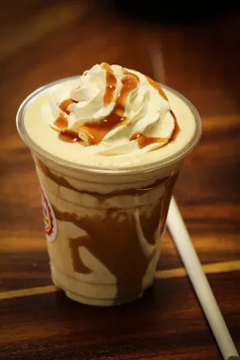 Caramel milkshake topped with cream